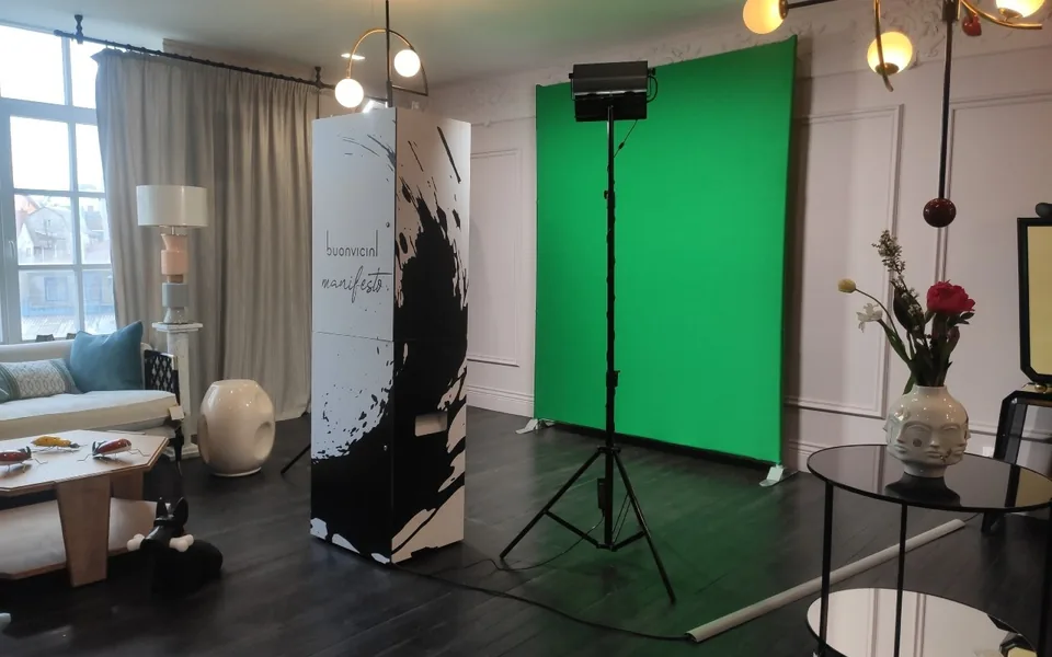 Green-screen booth with separate lights inside a real event room