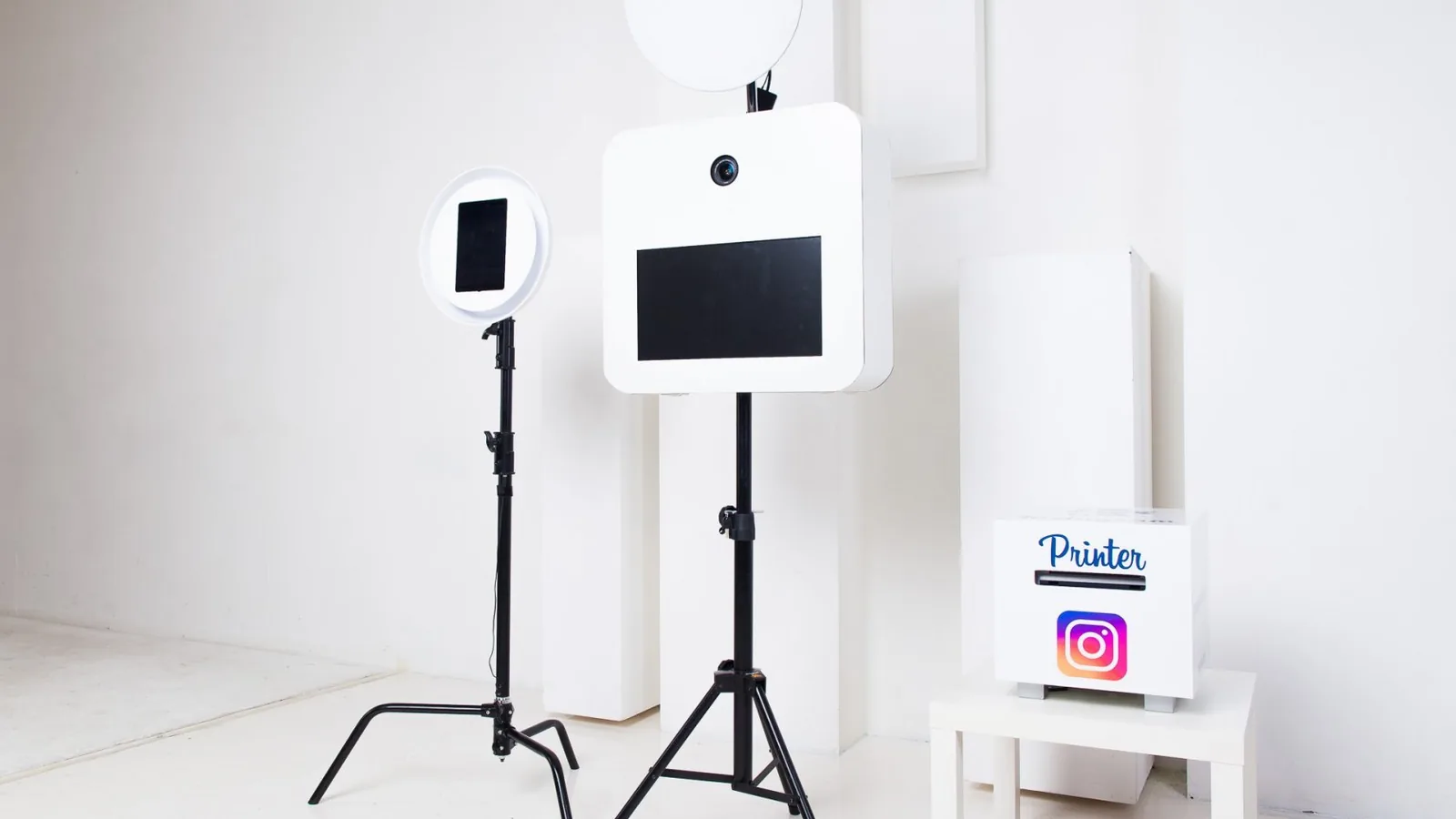 Open print booth with separate lights and printer hardware in a bright room