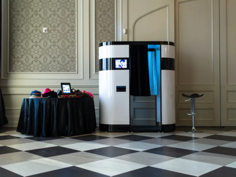 Photo booth installed in a ballroom with controlled front lighting