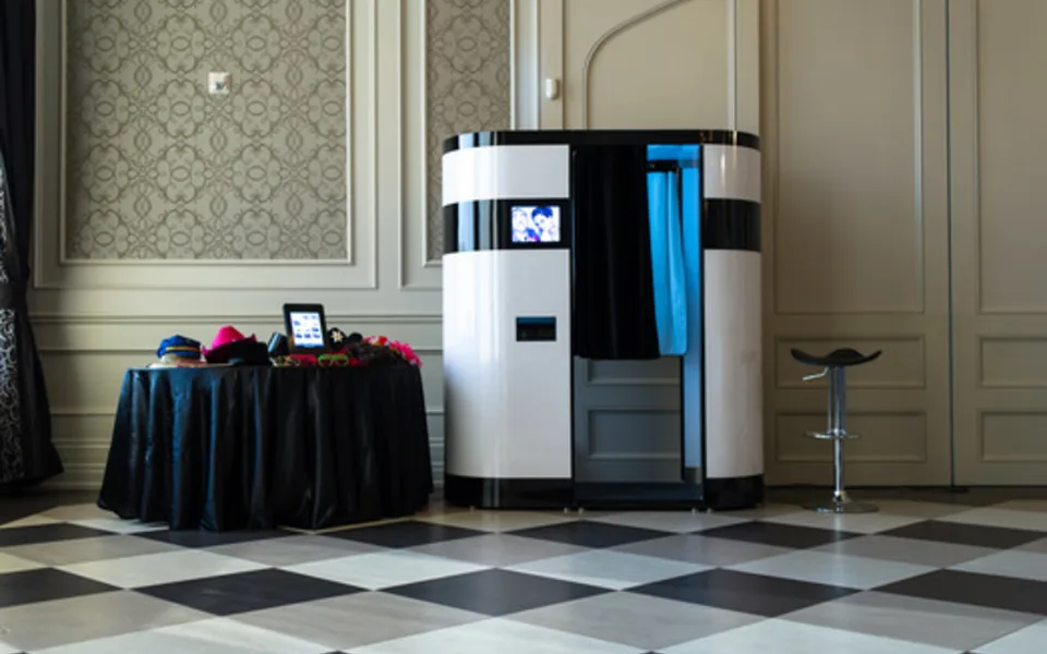 Photo booth installed in a ballroom with controlled front lighting