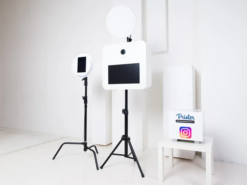 Open print booth with dedicated lights in a bright event room