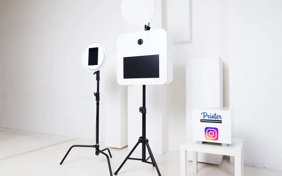 Open print booth with dedicated lights in a bright event room