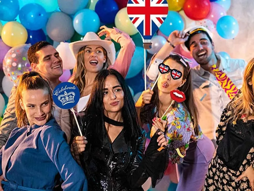 Guests using a StudioPic photo booth with printed strips