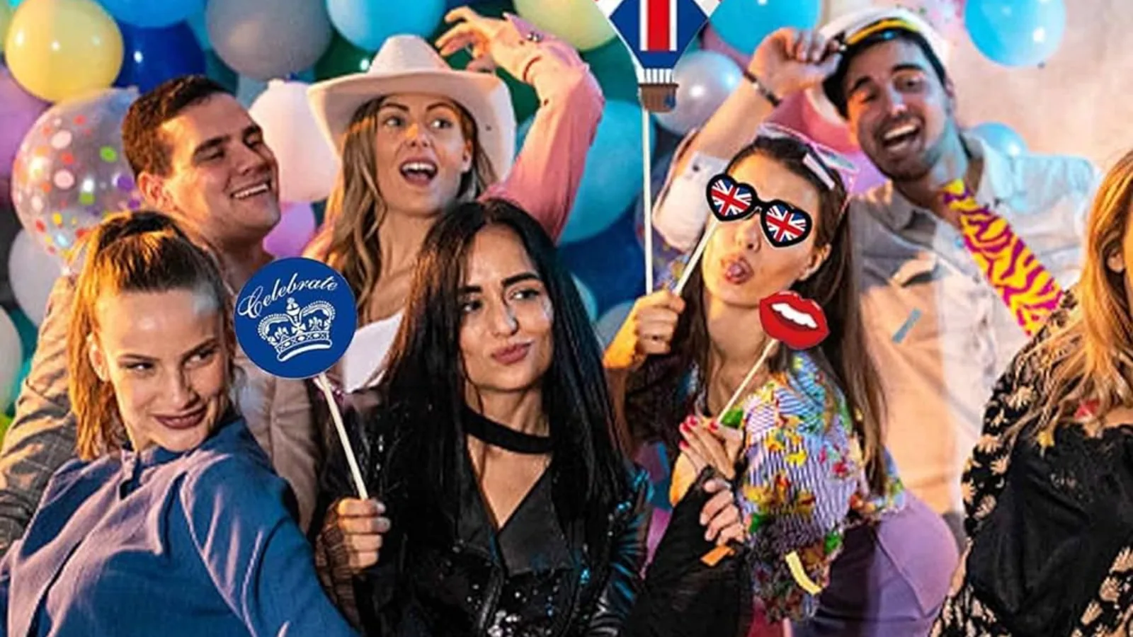 Guests using a StudioPic photo booth with printed strips